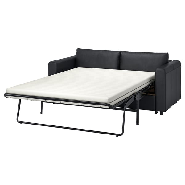 Dieses Bild zeigt ein schwarzes Schlafsofa von VIMLE, schlank und modern, das mit einem leicht zu reinigenden, wandelbaren Design auf Komfort ausgelegt ist.
