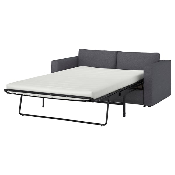 Das Bild zeigt ein dunkelgraues VIMLE-Schlafsofa mit einer dicken Matratze, das vielseitigen Komfort und praktisches Design bietet.