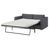 Das Bild zeigt ein dunkelgraues VIMLE-Schlafsofa mit einer dicken Matratze, das vielseitigen Komfort und praktisches Design bietet.
