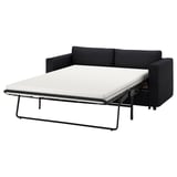 Das Schlafsofa VIMLE in Dunkelgrau bietet ein modernes, vielseitiges Design mit einem weichen, wandelbaren Sitzgefühl.