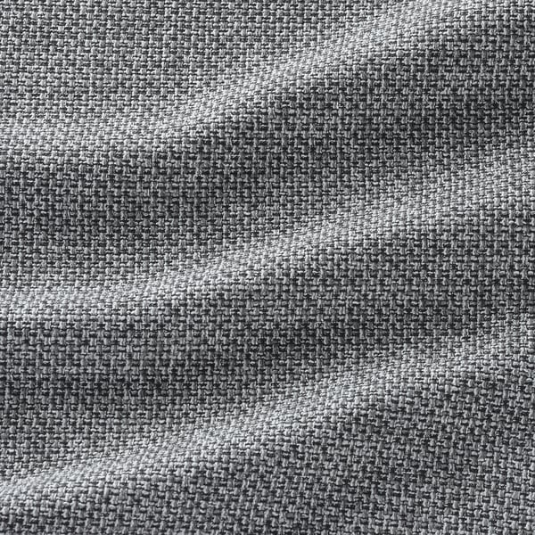 Nahaufnahme des gewebten Stoffes der VIMLE-Sofas, der sein enges, gleichmäßiges Gewebe und seine weichen, neutralen Grautöne zur Geltung bringt.