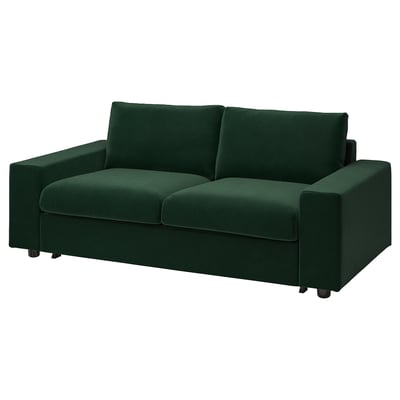 Modernes Schlafsofa aus grünem Stoff mit quadratischen Armlehnen und Kissen.