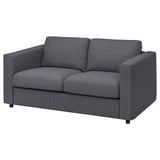 Dunkelgraues, modernes Sofa mit zwei Kissen, schlankem Design und robuster Konstruktion.