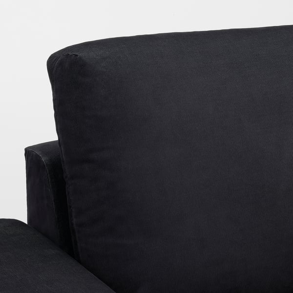 Schwarzes Sofa, modernes Design, eleganter Stoff, robuste Armlehnen.