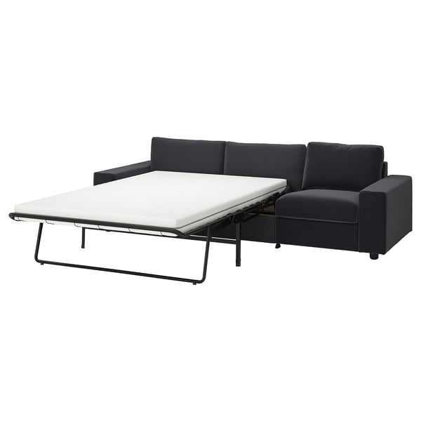 Ein schwarzes VIMLE Schlafsofa mit schlankem, modernem Design und einem umwandelbaren Bereich zum Schlafen.
