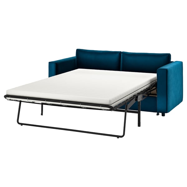 Blaues Schlafsofa mit weißer Matratze, schwarzes Metallgestell, modernes Design.