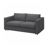 Dieses Bild zeigt ein modernes, graues DOMLE-Sofa mit schlankem Design, das mit seinem weichen und strapazierfähigen Stoff Komfort bietet.