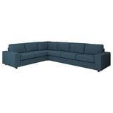 Großes blaues L-förmiges Sofa mit klaren Linien und kastenförmigen Kissen.