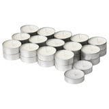 Collection of white ADLAD candles in silver holders, round and stacked in a cluster.