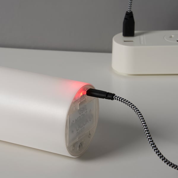 A cylindrical led candle with a flashing red light, charged via micro-usb. It senses motion and turns on/off with hand gestures.