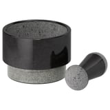 Black marble mortar and pestle set; smooth, round design.