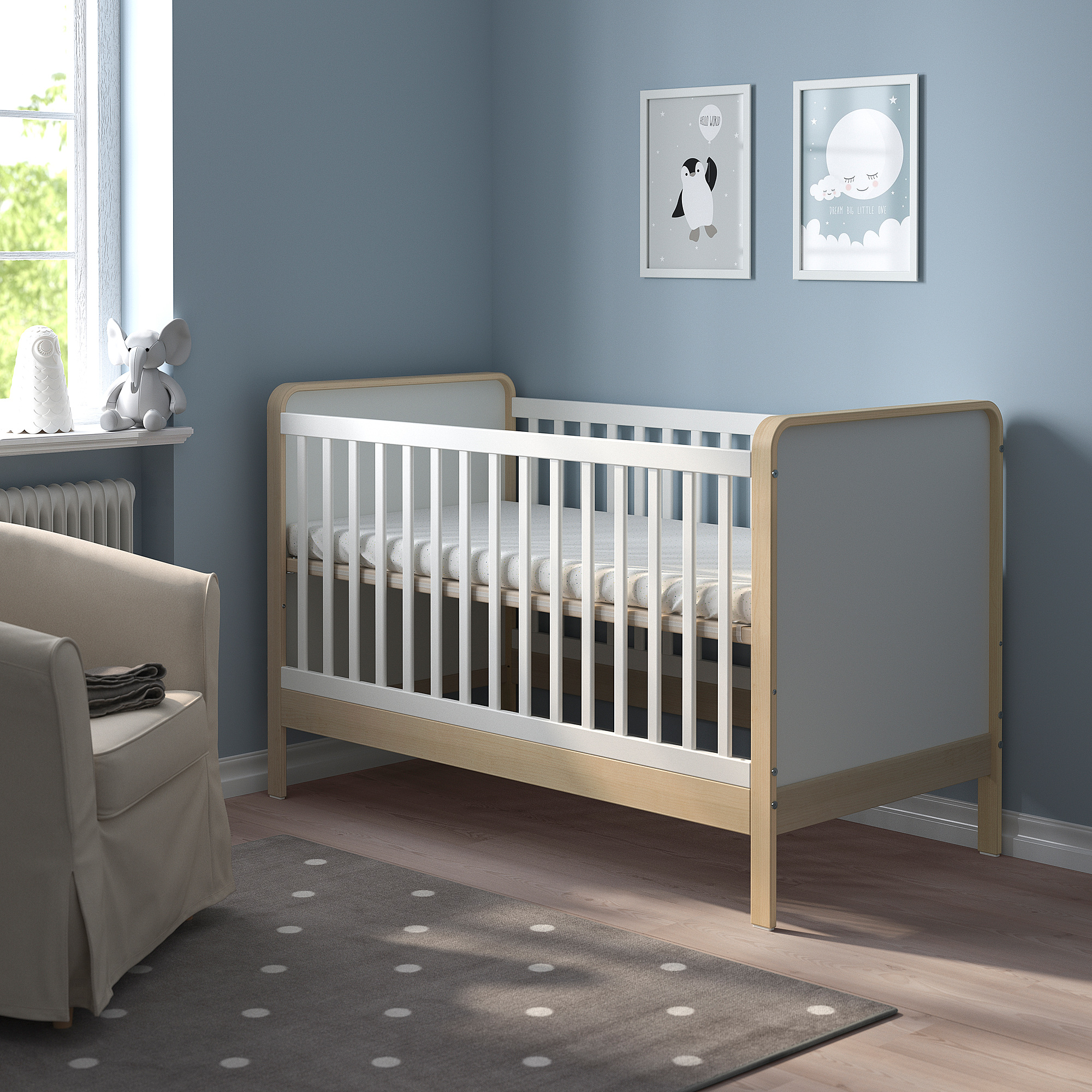Blue kids room, grey cot, art prints.