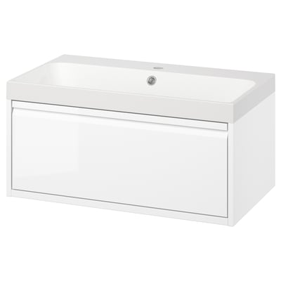 Modern white bathroom vanity with sleek handle-less drawer, wall-mounted, and marble top sink.