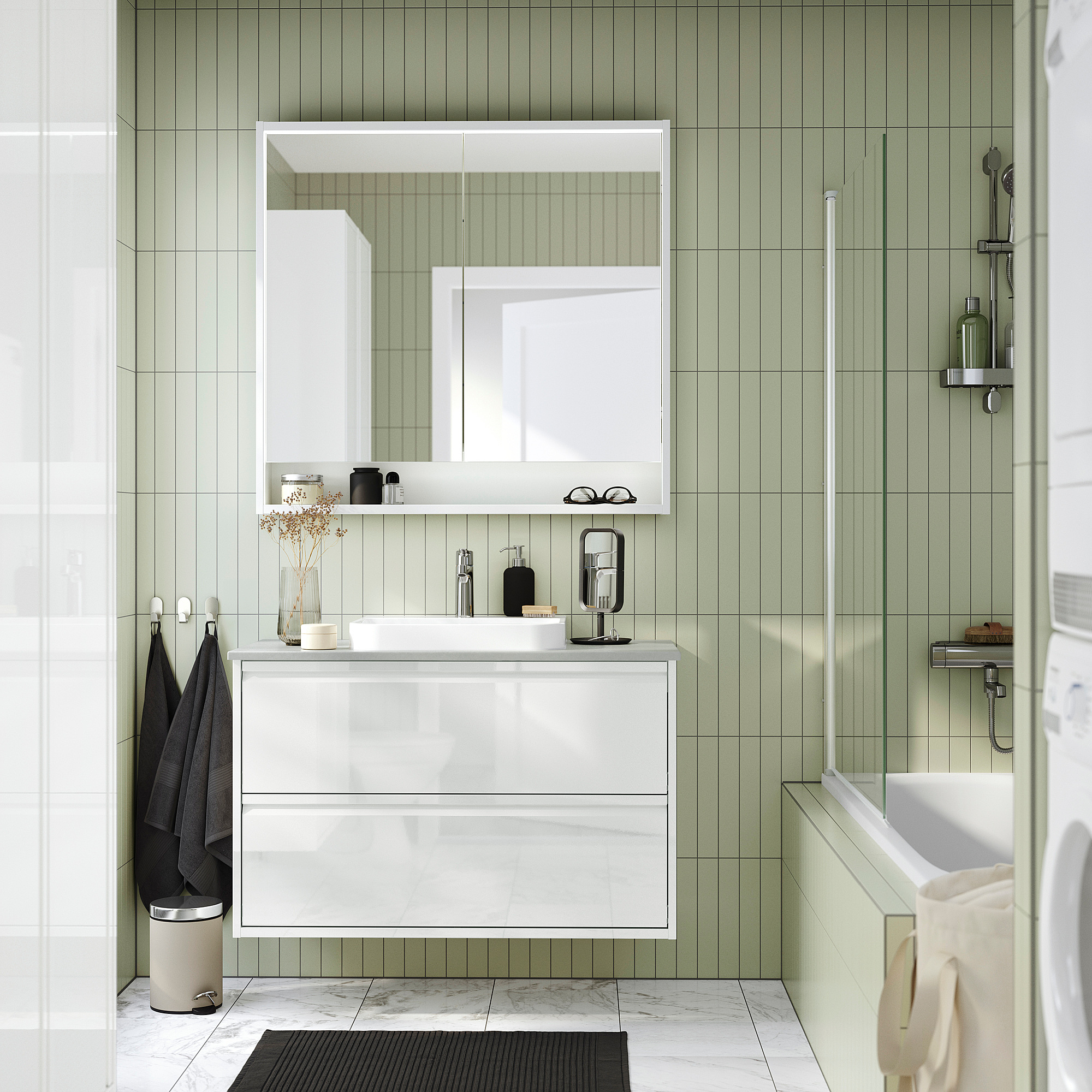 Modern white ÄNGSJÖN wash-stand with sleek design, wall-mounted for space, large mirror, glossy counter, substantial storage.