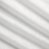 Elegant white curtains with intricate, raised leaf patterns. Soft, textured fabric offers a discreet, calming ambiance.