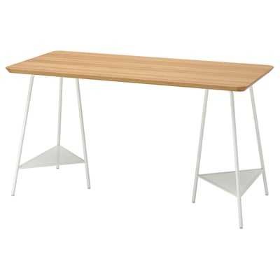 A wooden desk with white legs and metal triangular shelves.