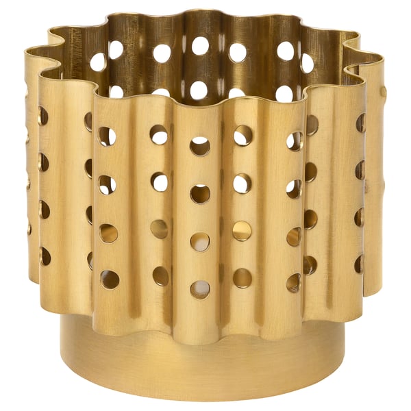 Brass-colored metal tealight holder with scalloped edge and circular cutouts for a warm, inviting glow.