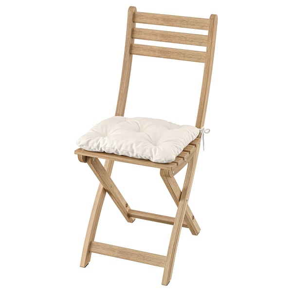 Light wooden foldable chair with white cushion seat.