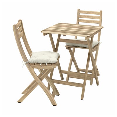 An ASKHOLMEN outdoor patio set in light brown wood with beige cushions. It includes a small square table and two folding chairs with slatted designs.