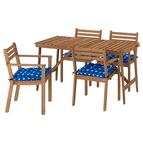 Outdoor dining set: 4 wooden chairs with blue cushions and square wooden table.