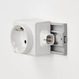 Wall-mounted electrical socket with on/off switch and removable adapter.