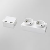 Two white ÅSKVÄDER power modules are displayed, one with dual usb ports and the other with two schuko sockets.