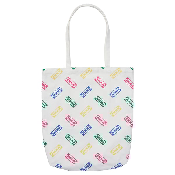 White tote bag with colourful IKEA logos, cotton material, rectangular shape, long handles.