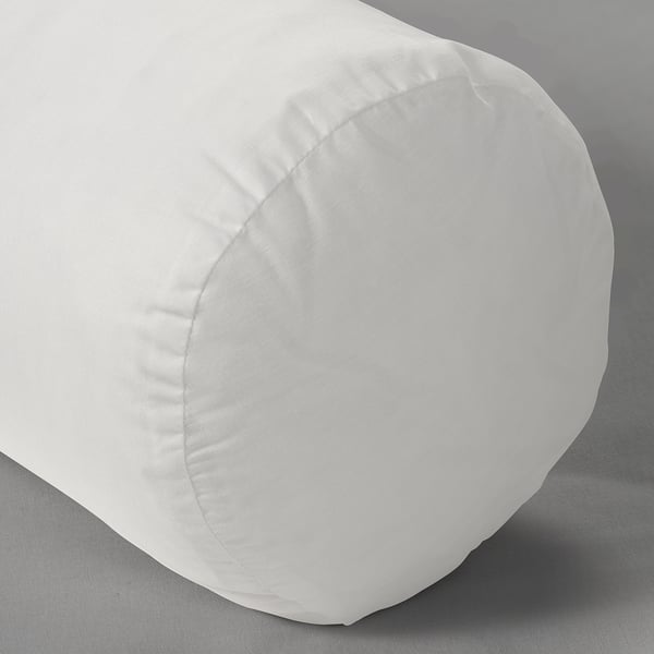 Soft, plush pillow with durable stitching, white color, on dark gray surface.