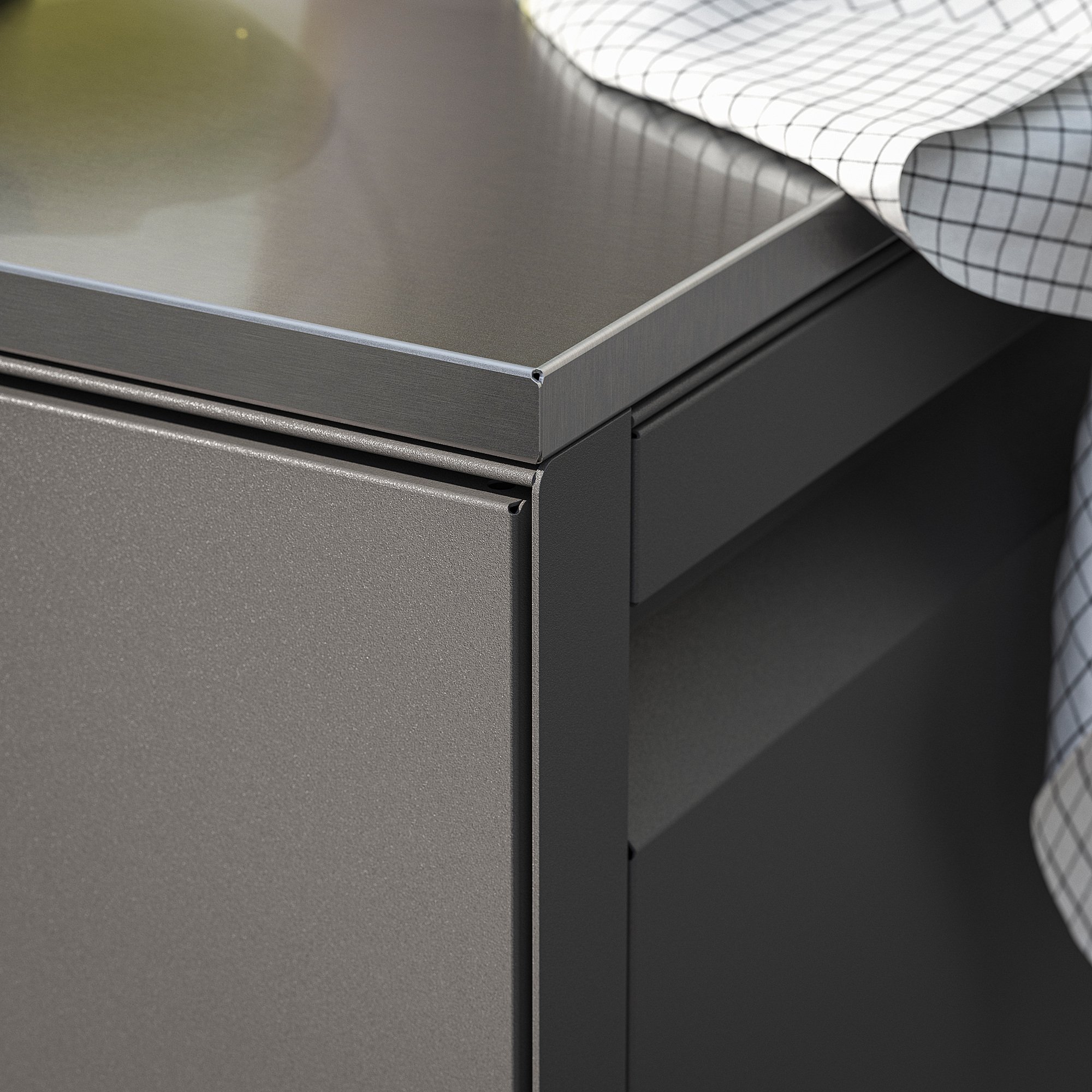 Modern outdoor kitchen with sleek, durable design, featuring closed storage and stainless steel details.