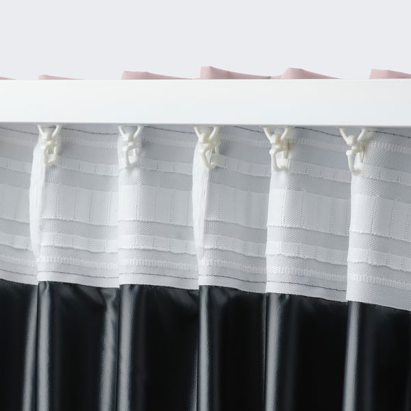 Curtain with hooks and loops for easy hanging, showcasing light-blocking fabric.