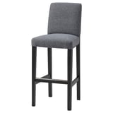 Grey upholstered bar stool with black metal legs and back support.