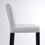 Modern grey fabric bar stool, sleek black legs, comfortable back support.