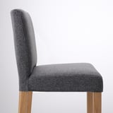 Modern grey upholstered bar stool with wooden legs. High back, comfortable cushioned seat. Elegant and functional design.