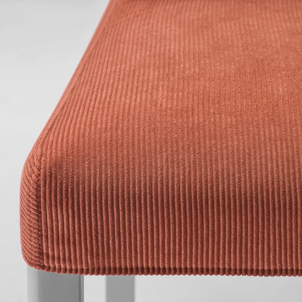 Close-up of a modern, textured, orange chair cover. Shows soft, ribbed fabric, likely made from recycled polyester.