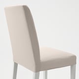 A beige upholstered chair with sleek legs, designed for comfort with optimal support and cushioning, presented in a minimalist setting.