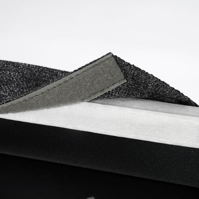 Stacked foam layers of a comfortable upholstered chair.