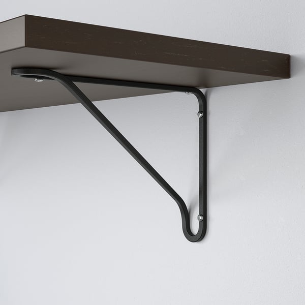 Dark wooden shelf supported by sleek, angled black metal brackets, securely mounted on a plain white wall.