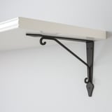 Modern wall shelf with black metal bracket, sturdy design, minimalist style.