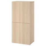 A light-colored wooden cabinet, part of the BESTÅ series, featuring two closed doors and a sleek rectangular design.