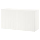 A white BESTÅ storage drawer unit. It is simple, rectangular, and wooden with a grooved design. Perfect for organizing home items.