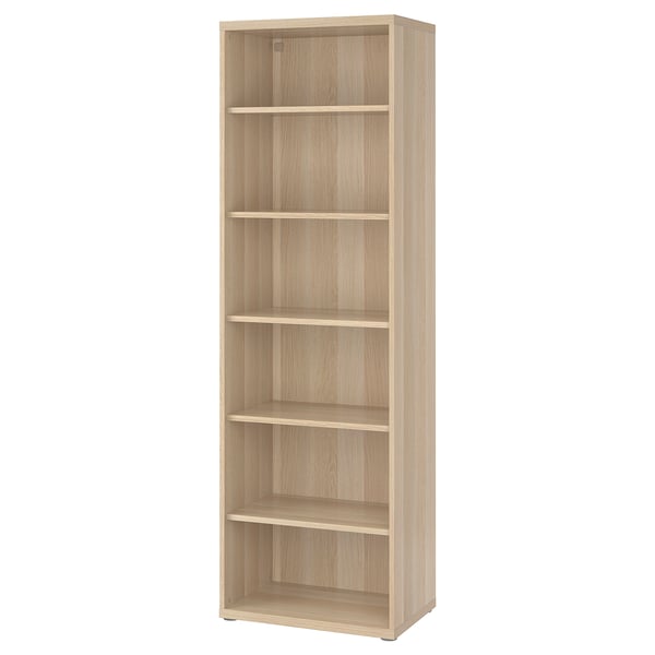 A light-colored, tall, rectangular BESTÅ bookshelf with six empty shelves. It has a minimalist design with a wooden finish.