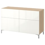 An ikea BESTÅ sideboard in white with wooden top and sides. It has four doors, two drawers, and stands on aluminum legs.