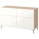 An ikea BESTÅ sideboard in white with wooden top and sides. It has four doors, two drawers, and stands on aluminum legs.