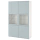 A light blue BESTÅ storage unit with glass doors. It has a rectangular shape and sleek design, combining storage and display.