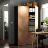 Modern wooden storage unit with adjustable shelves and soft-closing doors in home office.