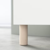 White BESTÅ sideboard leg made of birch.