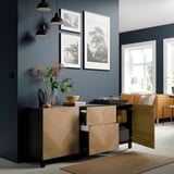 Modern sideboard with adjustable shelves and drawers. Open door shows storage space, with knobs for easy opening.