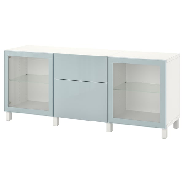 An ikea BESTÅ white and light blue sideboard with glass doors and adjustable shelves.