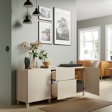Modern living room with BESTÅ sideboard, decorative items, and art under pendant lights.