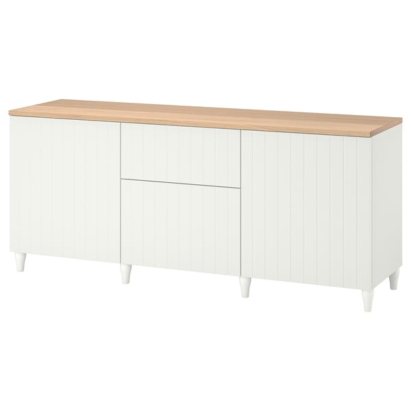 A white BESTÅ sideboard with wooden top, four legs, two drawers, and adjustable shelves.